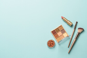 Make up products on blue background.
