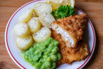  Breaded Cod Fillet With Sliced New Potatoes And Mushy Peas