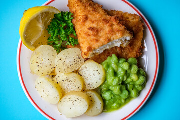  Breaded Cod Fillet With Sliced New Potatoes And Mushy Peas