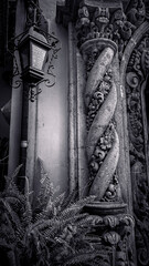 Baroque stone column and vintage lantern in black and white