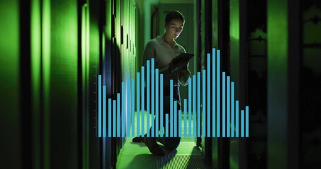 Kneeling technician holding tablet in narrow data center aisle, with floating bar-chart overlay