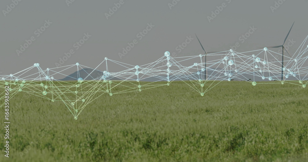 Poster projecting digital network overlay spanning field to wind turbines on farmland, with glowing nodes
