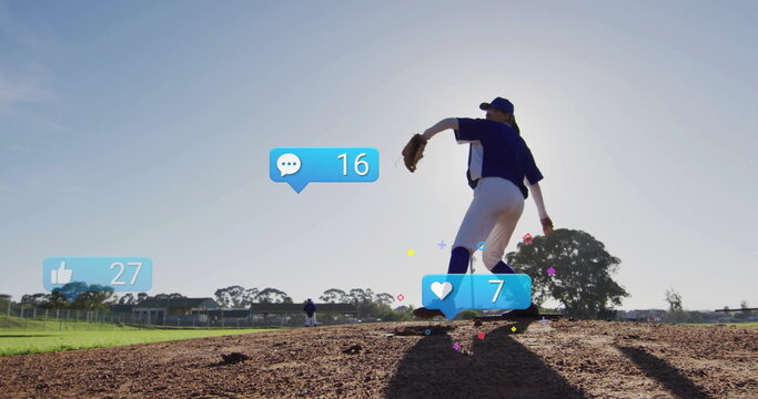 Pitcher wearing cap, blue uniform and glove winding up on mound, with social icons, copy space