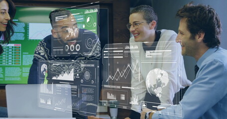 Group of professionals analyzing data in office conference room, with laptop and holographic charts