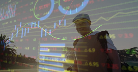 Standing Chinese golfer carrying golf bag with clubs on fairway, financial charts, copy space © vectorfusionart