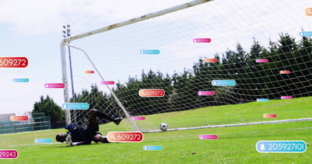 Diving goalkeeper wearing navy blue saving shot inside soccer goal net, with AI tags, copy space