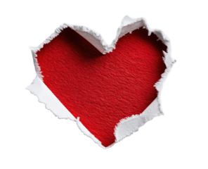 A red heart shape, punched out of white paper, on a black background
