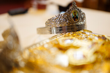 Orthodox wedding crown with icon of Jesus Christ in a church ceremony
