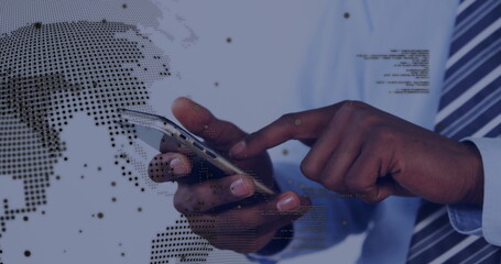 Tapping office worker wearing tie interacting with smartphone in office, world map and code overlay