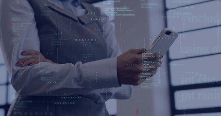 Holding smartphone professional woman in vest and shirt viewing code projections at modern office