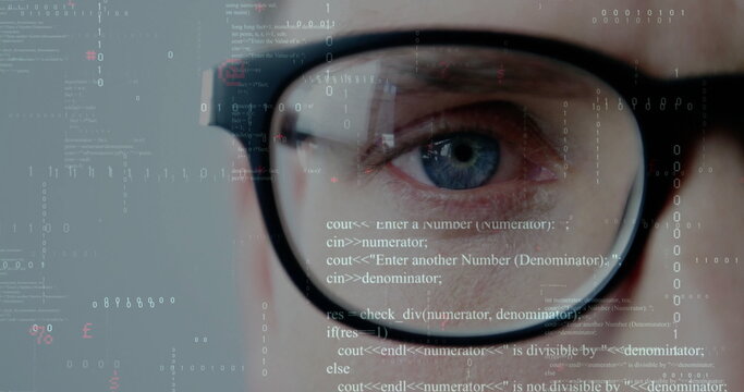 Focusing developer's eye behind black-rimmed glasses at digital interface with code and binary bits