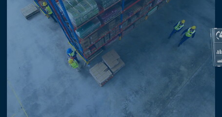 Workers wearing safety vests and hard hats stacking boxes on metal racks at warehouse, copy space