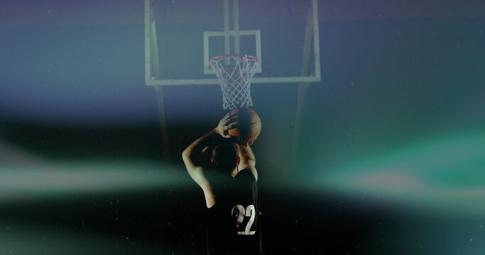 Standing basketball player raising ball at free-throw line in hazy arena, with hoop, net, jersey 22 - Powered by Adobe