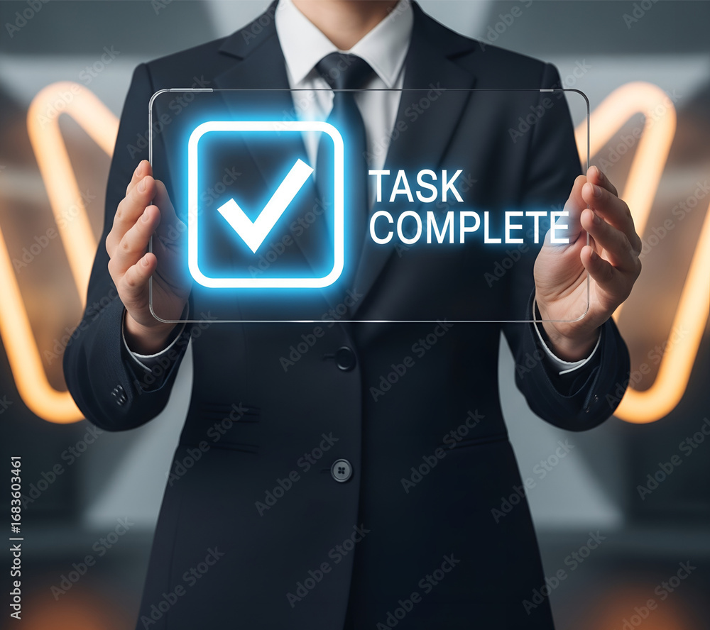 Poster businessman holding a digital screen displaying a glowing checkmark and task complete message