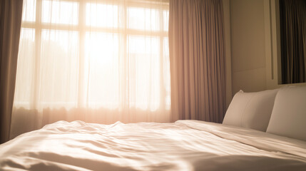 A serene hotel bedroom bathed in morning light, featuring a neatly made bed and minimalist decor.
