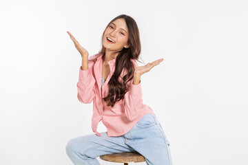 A joyful woman poses with a bright smile, showcasing her positivity and confidence