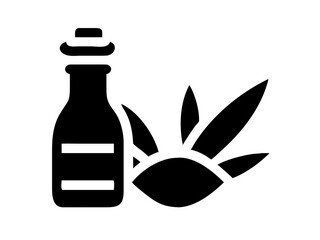 Bottle of essential oil with leaves of aloe vera plant used for natural skin care and beauty product