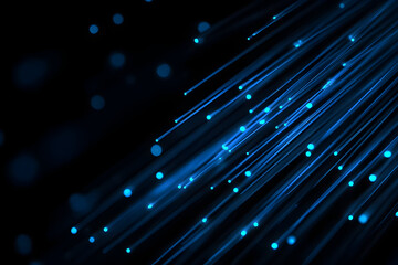 Colorful light streaks create a vibrant abstract background with luminous blue particles in a dark setting