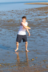 Teenage Boy Playing With A Frisbee