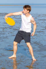 Teenage Boy Playing With A Frisbee