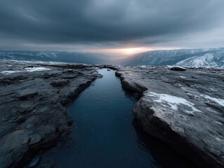 Obraz premium Scorched earth and split open wasteland under a dramatic sky at sunset