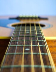 Close-up acoustic guitar fretboard