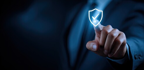 A hand in a suit interacts with a glowing shield icon, signifying digital security