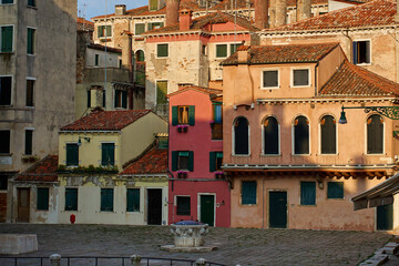 Historic residential buildings with colorful facades in Venice, Italy. Traditional European architecture and travel destination.