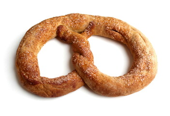 On a white background lies a bakery product called a pretzel.