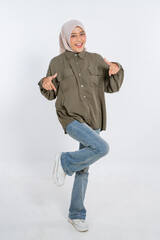 A cheerful woman dressed in a stylish outfit, truly exuding confidence and genuine joy