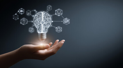 Glowing light bulb hovers above an outstretched hand, symbolizing creativity and innovation in a digital environment