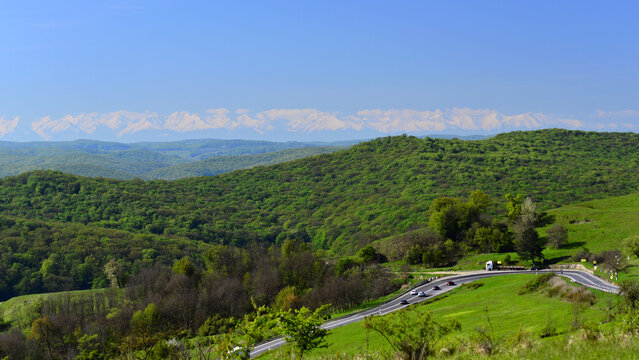 Transylvania. European Route E60. Fagaras Peaks in the horizon. 