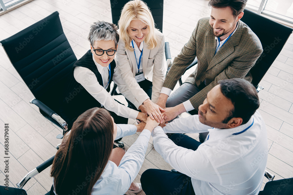 Aufkleber diverse team of business professionals collaborating in a modern office setting with unified hands d