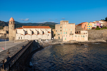 View of colourful Collioure, narrow streets and yellow, pink, orange houses, summer vacation...
