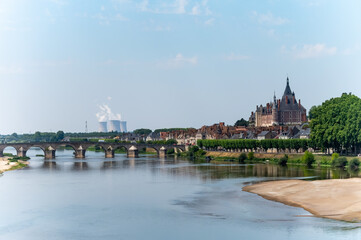 View on cooling towers of nuclear power plant thermal power station in which heat source is nuclear reactor, France, Europe, cheap energy source, Gien on Loire river