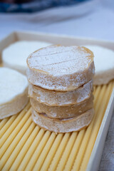 Rocamadour white and aged soft goat AOC cheese with soft rind produced on farm in Perigord and Quercy takes its name from village of Rocamadour in departement Lot, France close up