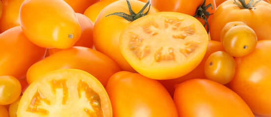 Many ripe yellow tomatoes as background, closeup