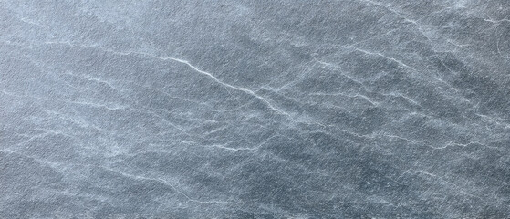 Obraz premium Travertine leathered stone with fine natural white veins and cool gray tones