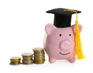 Scholarship. Piggy bank with graduate hat and stacked coins on white background