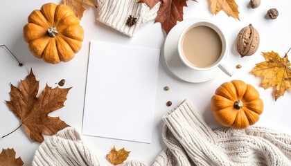 Autumnal flatlay with pumpkins, leaves, coffee, and a blank card