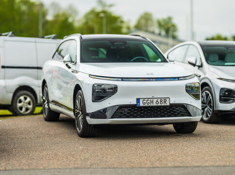 Gothenburg, Sweden - May 11 2025: White 2024 Xpeng G9 electric SUV parked in urban lot.