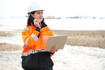 Environmental engineer or ecological scientist industrial worker in safety uniform working for...