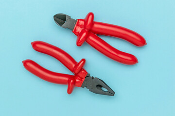 Creative Image of Tools Wrapped in Red Balloon Artistry on Soft Blue Background