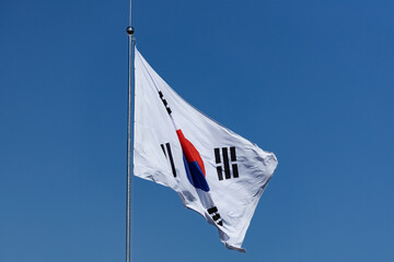 South Korean flag waving on the wind against blue sky
