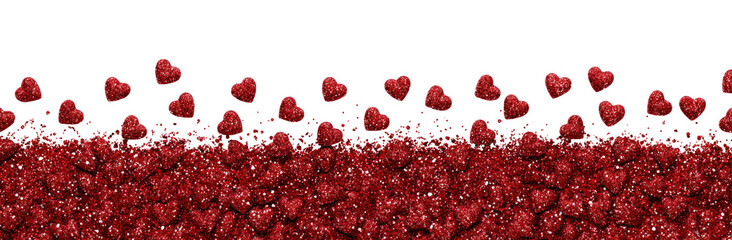 Red heart-shaped particles cascading over a dark surface
