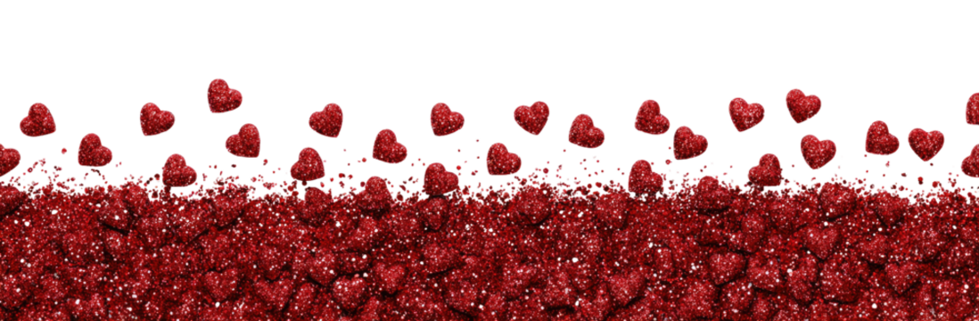 Red heart-shaped particles cascading over a dark surface