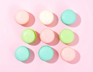 Assorted Pastel Macarons on Soft Pink Background – Elegant Dessert Arrangement