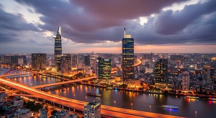 Fototapeta premium Ho chi minh city skyline at night with illuminated buildings and a river
