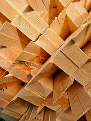 Stack of wooden boards as a background. Close-up view.
