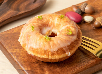 Lemon Frosted Doughnut on a Wooden Board side view of hong kong food
